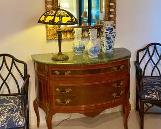 Antique commode w marble top , antique lamp , pair of bamboo armchairs , blue and white decor 