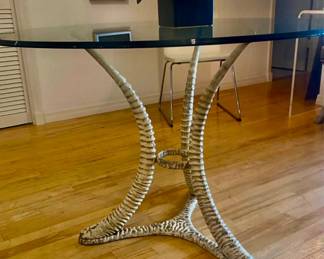 Signed designer metal horn table w beveled glass top 
