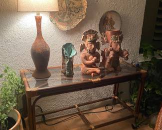 Rattan console , midcentury stone lamps and, handmade vase , pair of  male and female Mexican sculptures 