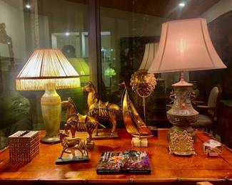 Desk , antique lamps (2) , horse decor , sailboat decor , horse decor , bronze letter holder , bronze tissue cover , bronze lion head 