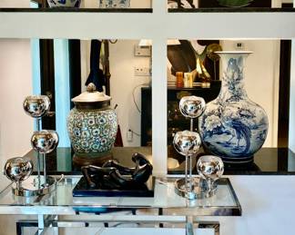 Burl and white GINGER jars (2) ,Asian vase with bronze base and top, extra large blue and white vase , circle of life marble sculpture, chrome pair of lamps , chrome console , Agustín Cárdenas sculpture 