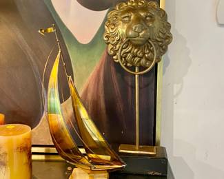 Lion head bronze , sailboat art 