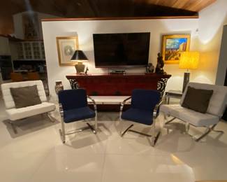 Pair of Barcelona chairs in white , chrome armchairs w blue upholstery, art and lamps 
