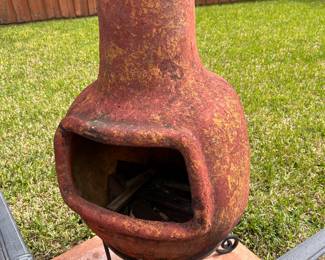 CLAY CHIMINEA ON CAST IRON STAND