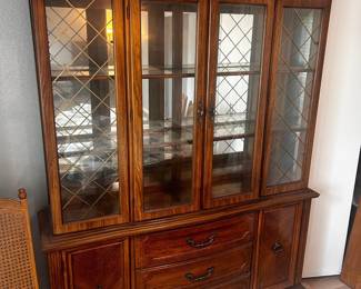 Vintage Lighted China Cabinet Great condition  Top and bottom are separate pieces 64” long x 16” deep x 7’ tall Must be able to move and load yourself