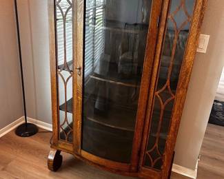 Antique Tiger Oak Curio Cabinet / Bookcase Great condition.  Some very minor imperfections Has key but does not work 36” across x 17” deep x 5’ tall  Must be able to move and load yourself