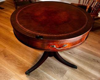 Genuine Mahogany and Leather Round Table  Very small imperfections on tabletop. 30” across x 28” tall  Must be able to move and load yourself