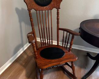 Unique Antique Carved Wood & Leather Rocking Chair 23” across x 20” deep Does have a little damage on top of chair