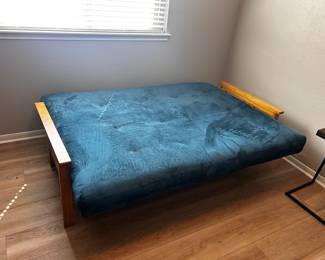 Futon  Does not lock into place when trying to fold into couch. It is missing a bolt. Second photo shows true color.  Must be able to move and load yourself.