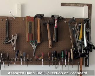 Assorted Hand Tool Collection on Pegboard