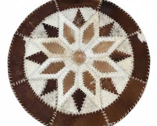 Patchwork Cowhide Round Rug with Starburst Pattern