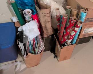 Assorted Holiday Wrapping Paper Rolls and Greeting Cards
