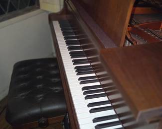 Slides away and folds down close the top and/or to secure it when not in use, or moving the paino