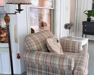 Plaid club chair, bright white side table, floor lamp