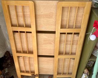 Entering the garage. Two like new collapsable wood shelves.