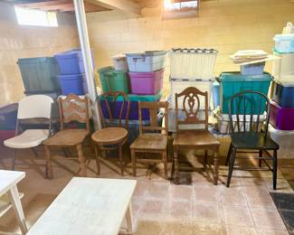 Odd chairs and plastic totes.