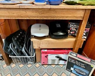Brand new in box pressure cooker, George Foremen grills and cookie sheets.