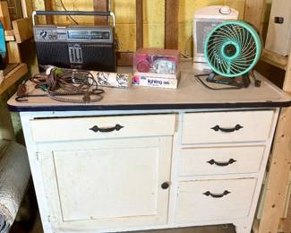 Antique wood kitchen cabinet with enamel top.