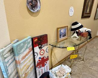 Radio of artwork in hallway, bubble, glass and brass side table, handmade doilies