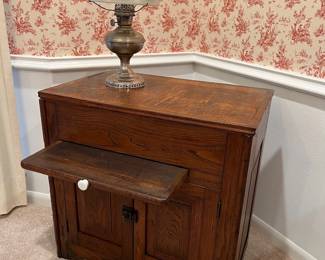 Vintage (c 1900) two door oak dry sink with pull out work surface and paneled sides. 