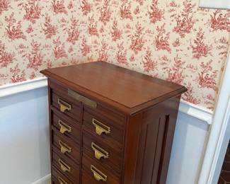 Vintage (1890-1920) Walnut Shannon Filing Cabinet with paneled sides, drawer interiors designed with two-hole punch integrated clipboards of alternaing light/dark wood.  Original decorative brass pulls with stylized "S".  Mfg by Schlicht & Field of Rochester, NY.