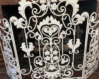 White wrought iron fire screen