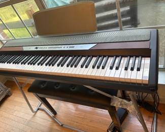 KORG keyboard on stand with bench
