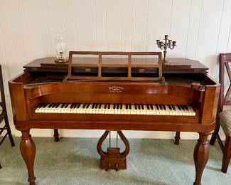 Very Rare 20th Century “Early American” Style Mathushek Spinet Grand Piano In Brown Mahogany Wood. In the 1930s era, the Mathushek firm went against the norm and introduced a line of tiny square grand pianos called the Spinet Grand. These "contemporary" instruments were based on the same general design of Mathushek 19th Century square grand pianos, but were redesigned in style and appearance so that they would fit well with décor. 