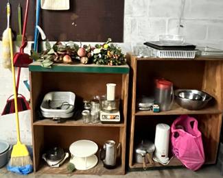 An assortment of kitchen items and brooms