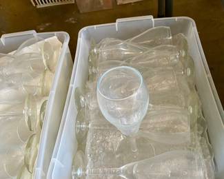 we have dozens of small wine/champagne glasses, and small glass plates perfect for the caterer