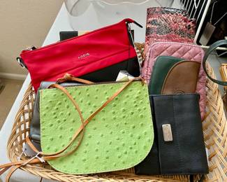 dozens of handbags, all shapes, sizes and fabric, all like new