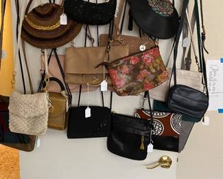 dozens of handbags, all shapes, sizes and fabric, all like new