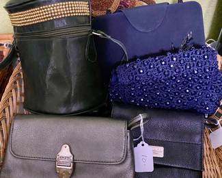 dozens of handbags, all shapes, sizes and fabric, all like new