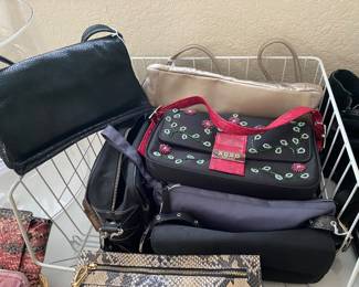 dozens of handbags, all shapes, sizes and fabric, all like new