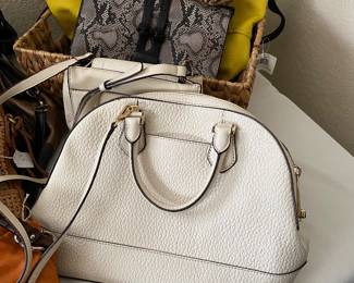 dozens of handbags, all shapes, sizes and fabric, all like new