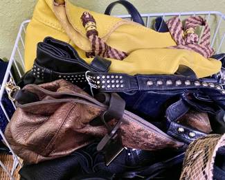 dozens of handbags, all shapes, sizes and fabric, all like new