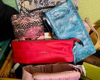 dozens of handbags, all shapes, sizes and fabric, all like new