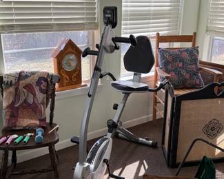 Sitting exercise bike with feet and hand pedals