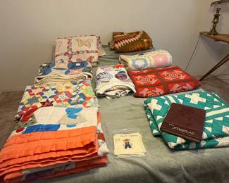 Handmade quilts, some in great condition, some great for crafting