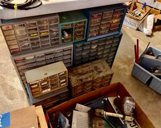 Several hardware cabinets in multiple sizes, some metal & some plastic