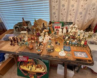 Many beautiful Nativity sets and vintage wood table