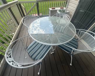 $140 White wrought iron patio set with glass top