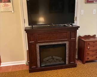 Flat screen Tv on Modern electric fireplace