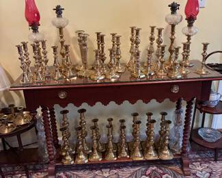 Collection of antique pushup brass candleholders