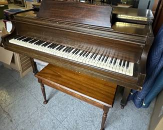 Baby grand piano....