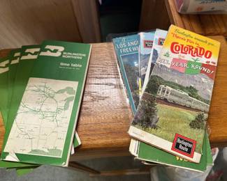 Vintage road maps and Burlington Northern train schedules