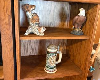 1978 Avon "Sporting" Ceramic Beer Stein. Vintage 1978 Homco Masterpiece Porcelain Three Raccoons Log Wood Figurine. Bald Eagle "Pride of America" figurine produced by Avon in 1982 