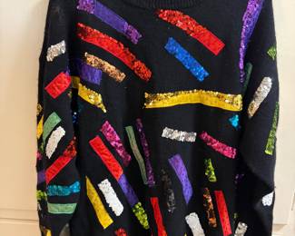 Cedars brand black sweater featuring multicolored sequined embellishments