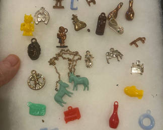 Lot 27: 26 cracker jack charms from the 1930s and 40s
