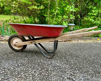 Metal and wood child's wheelbarrow.